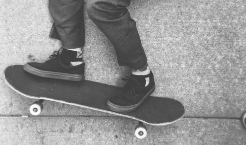 A skateboarder, looking to the left